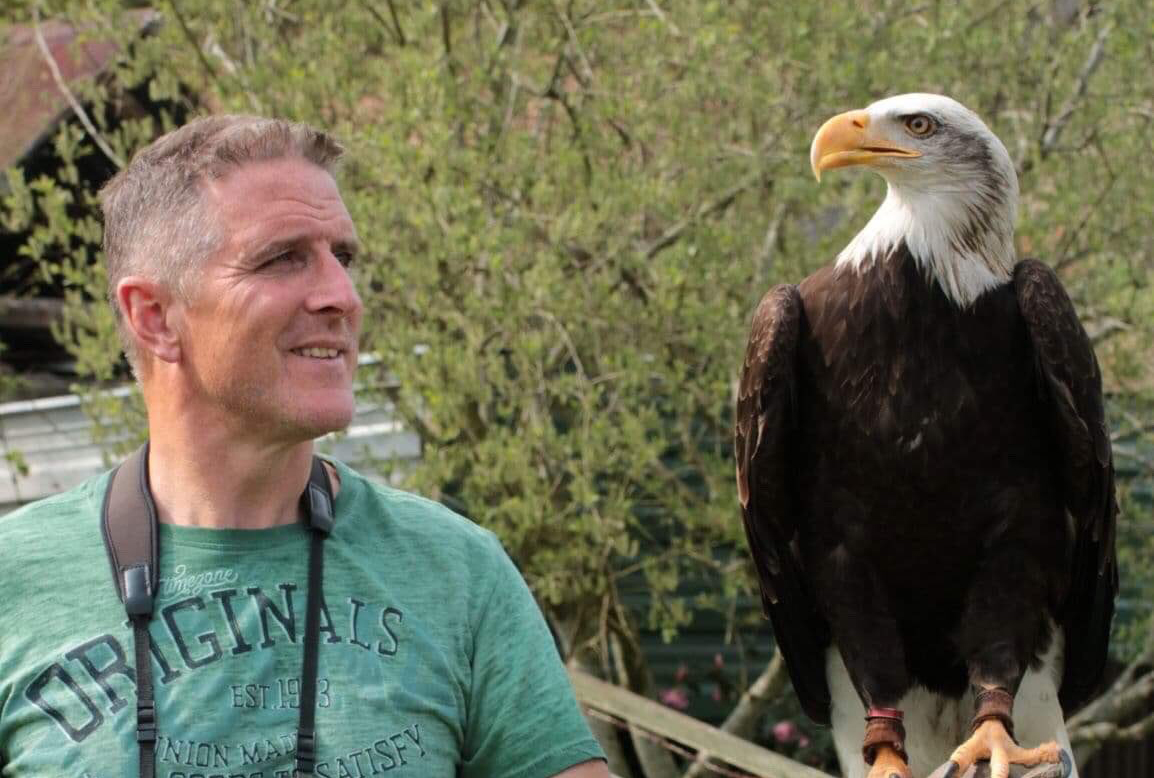 Iolo Williams with a bald eagle